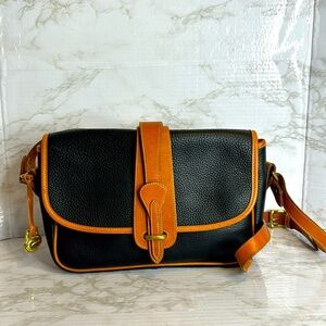 Dooney & Bourke Vtg equestrian blk Pebbled Leather with Brown Trim crossbody